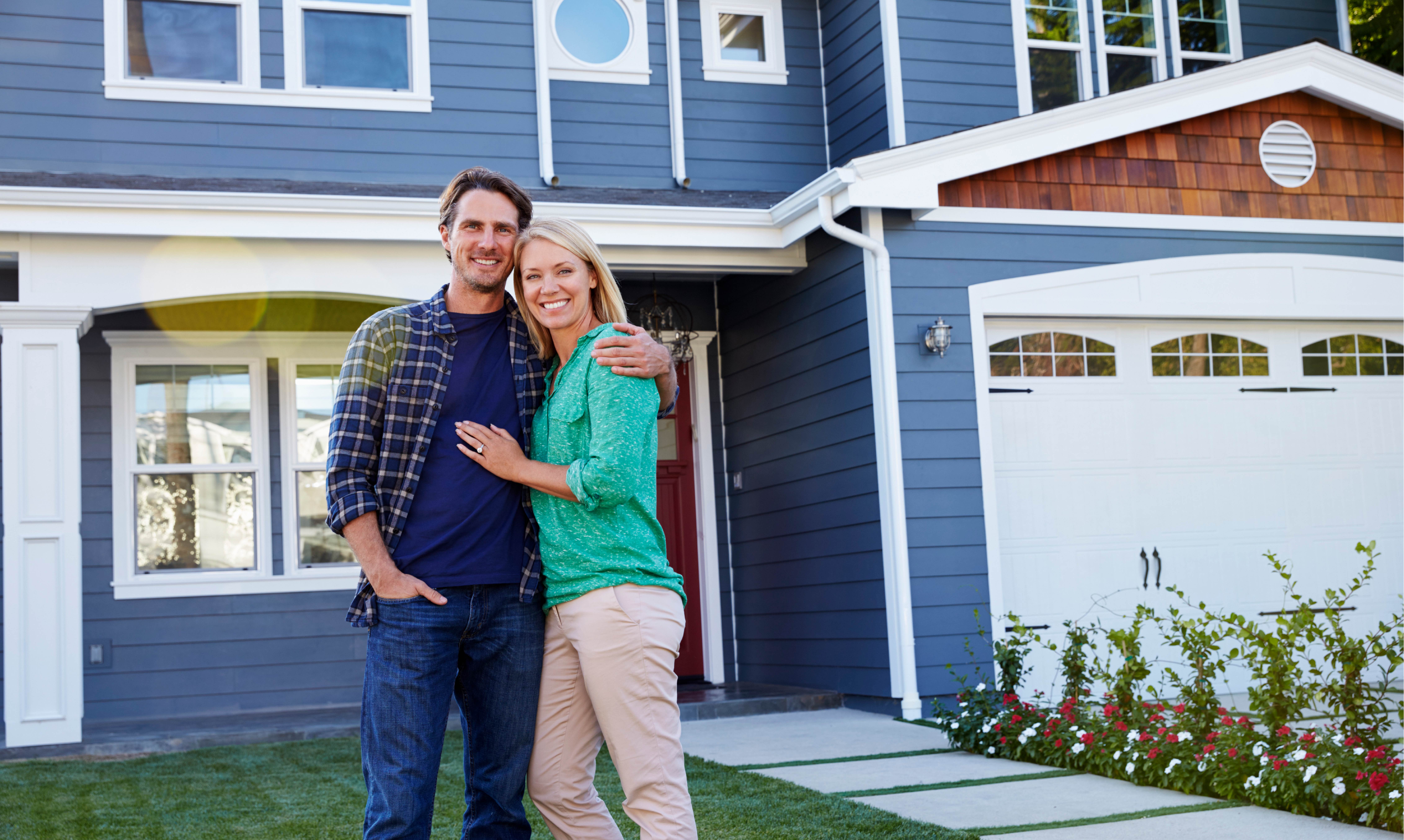 website temp-13 couple in front of house